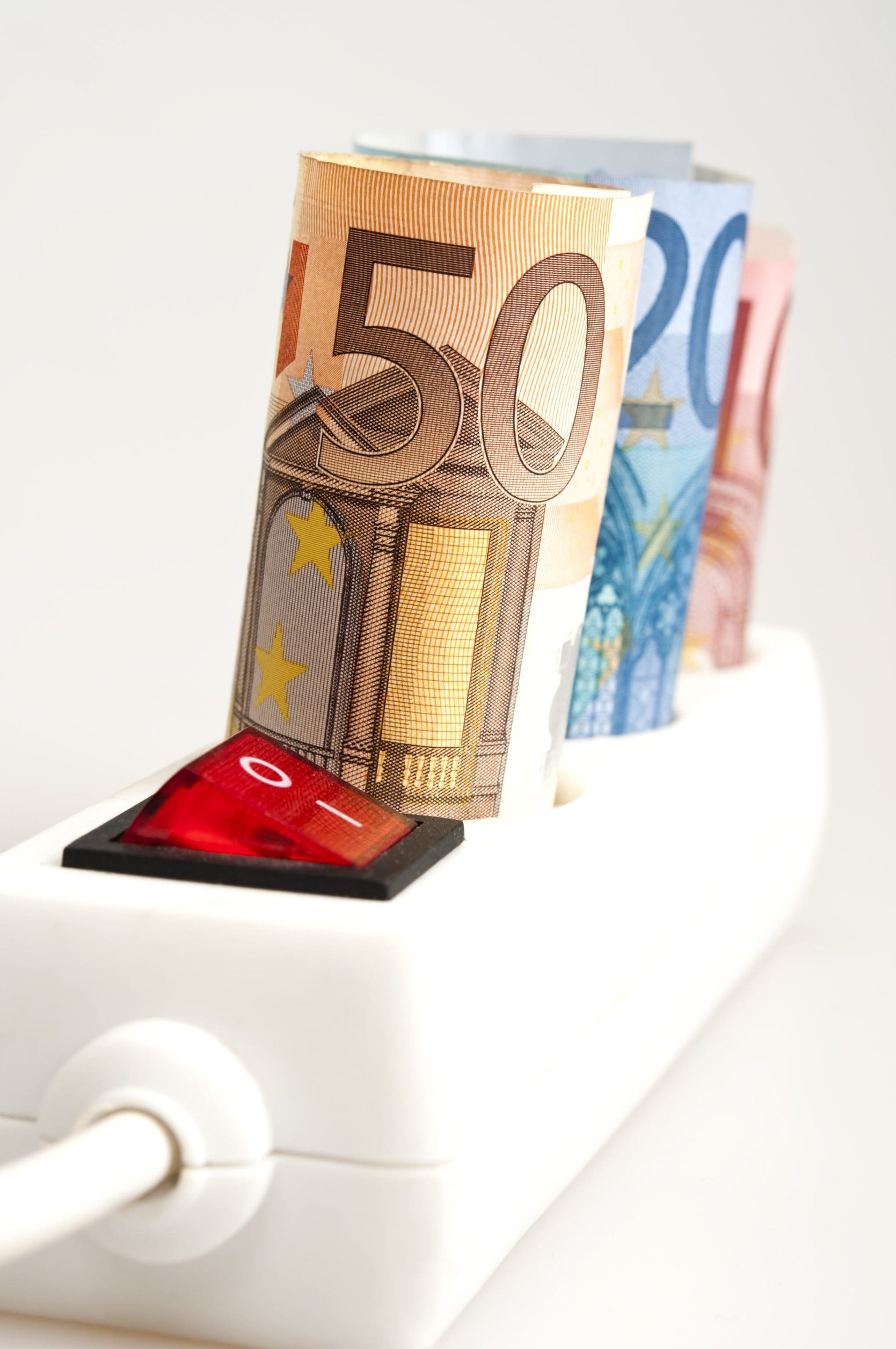 Euro banknotes on power outlet